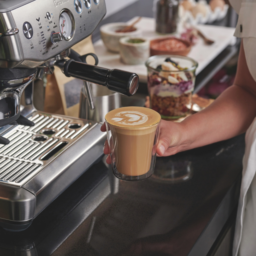 barista express impress latte in hand