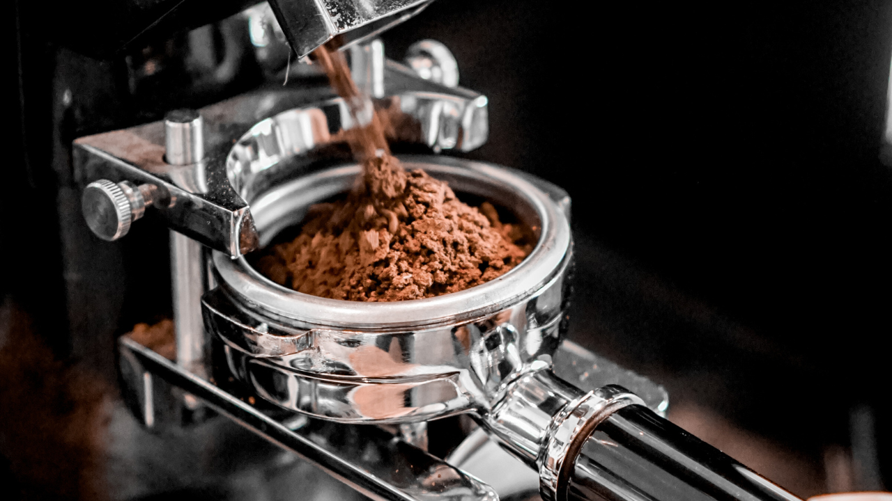 coffee grinder grinding into a portafilter
