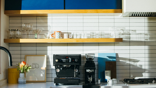 la marzocco linea mini espresso machine in a lit kitchen