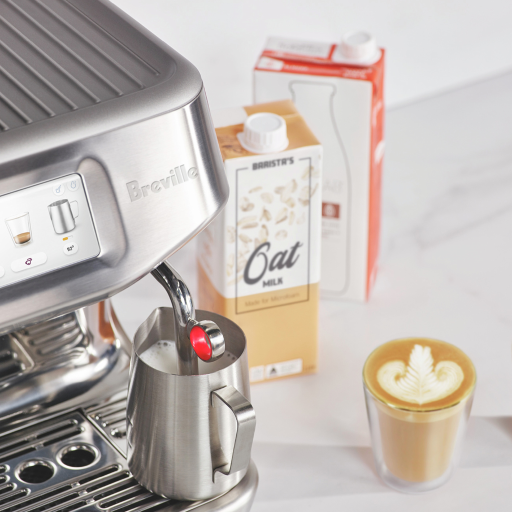 breville barista touch impress milk steaming closeup