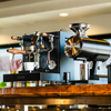 lucca sunto next to a grinder