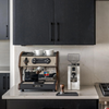 lucca a53 mini walnut espresso machine next to a white Eureka coffee grinder