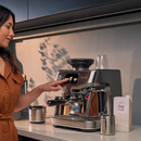 woman using Breville THE ORACLE JET