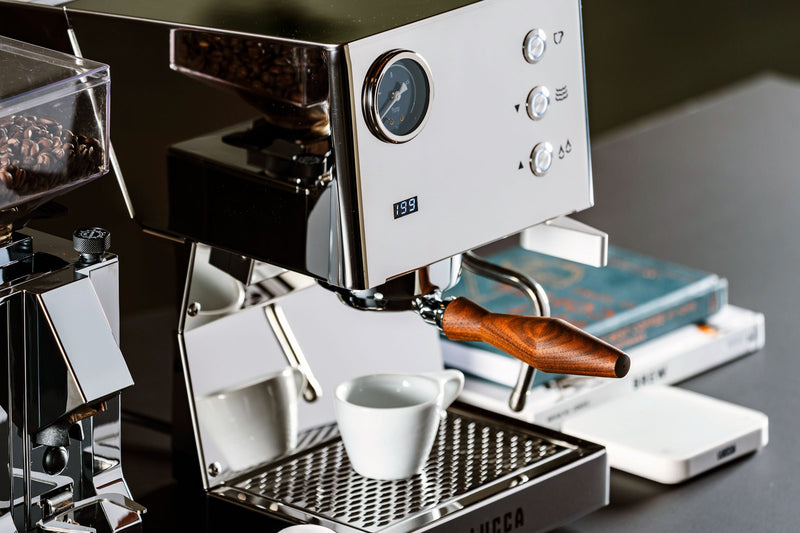 Espresso machine with a wooden handle on a dark surface