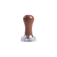 Coffee tamp with wooden handle and metal base on a white background