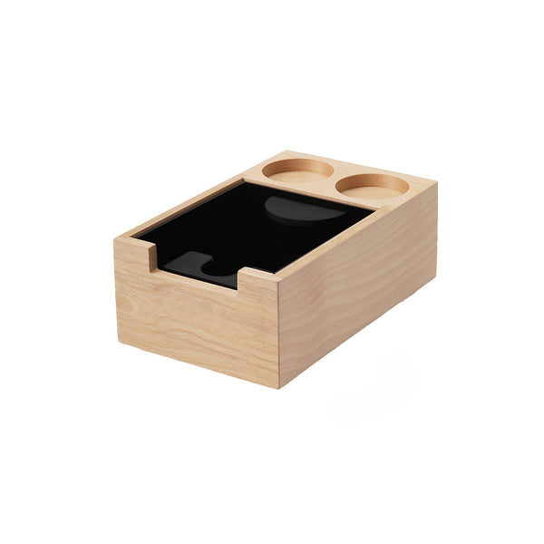 Wooden knockbox with a black interior on a white background