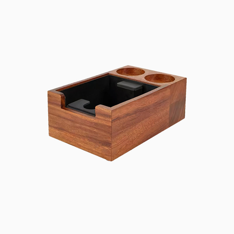 Wooden tamping station with black interior on a white background