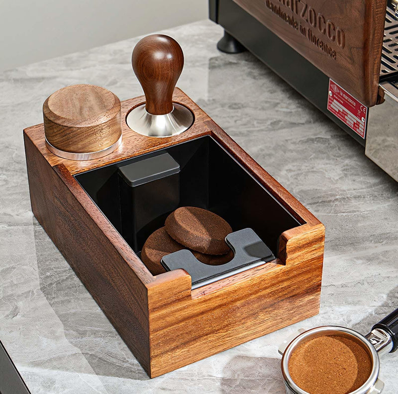 Wooden coffee tool set with various components on a marble surface