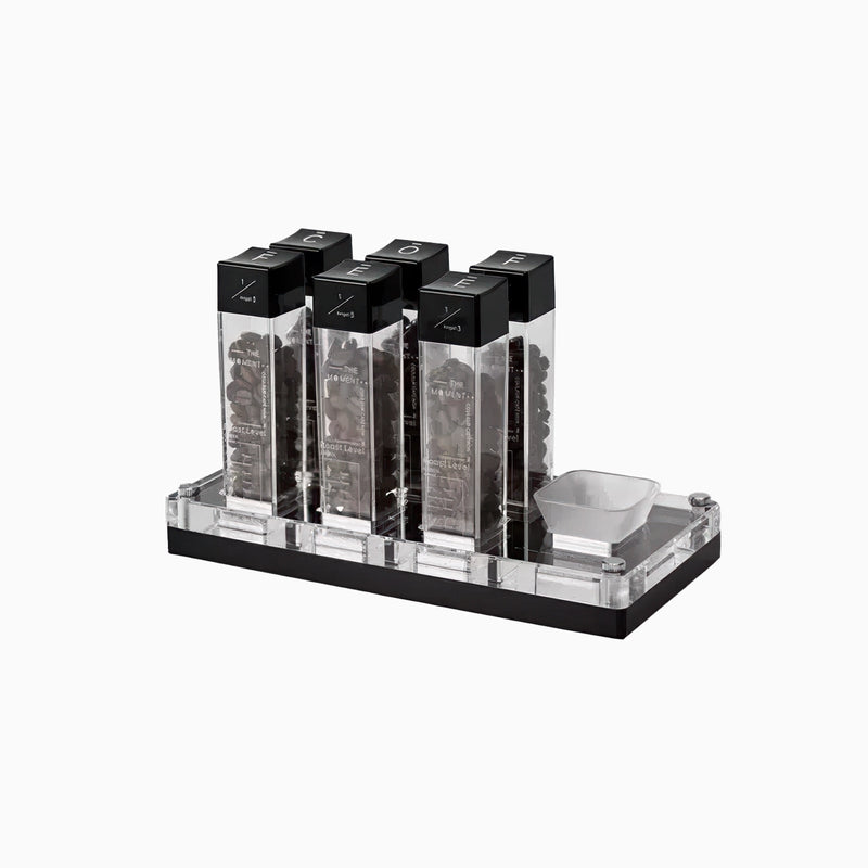 Set of black and clear containers on a white background