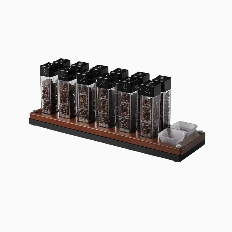 Set of coffee pods on a wooden stand with a white background