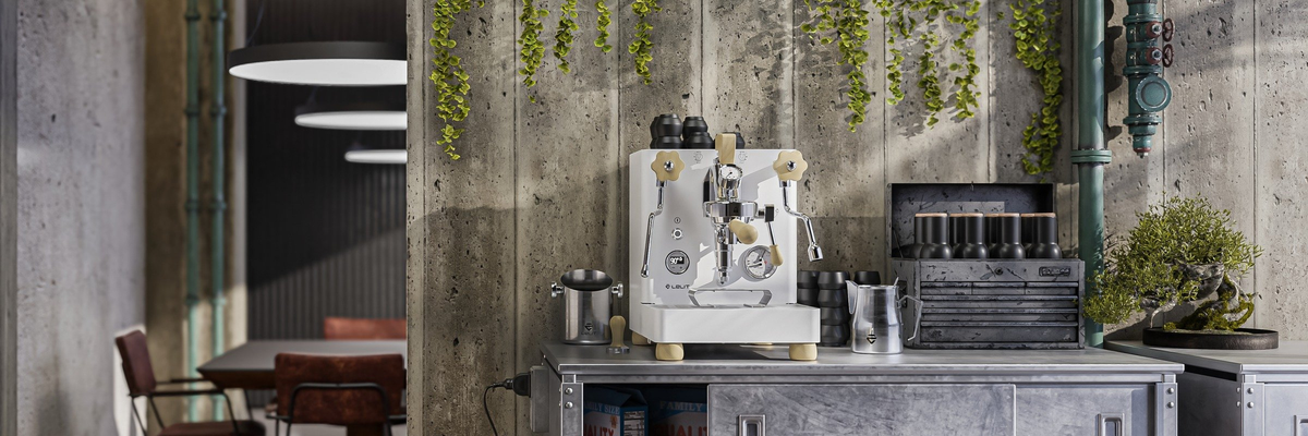 lelit bianca in a industrial kitchen with greenery and accessories